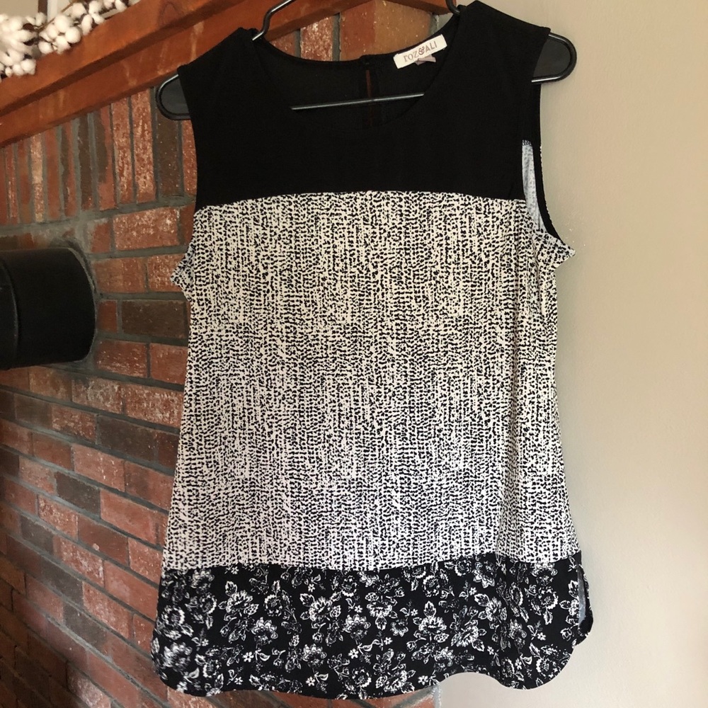Black and white sleeveless blouse